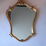 1950s rococo mirror in gilded stucco.