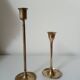 Set of two straight brass candlesticks.