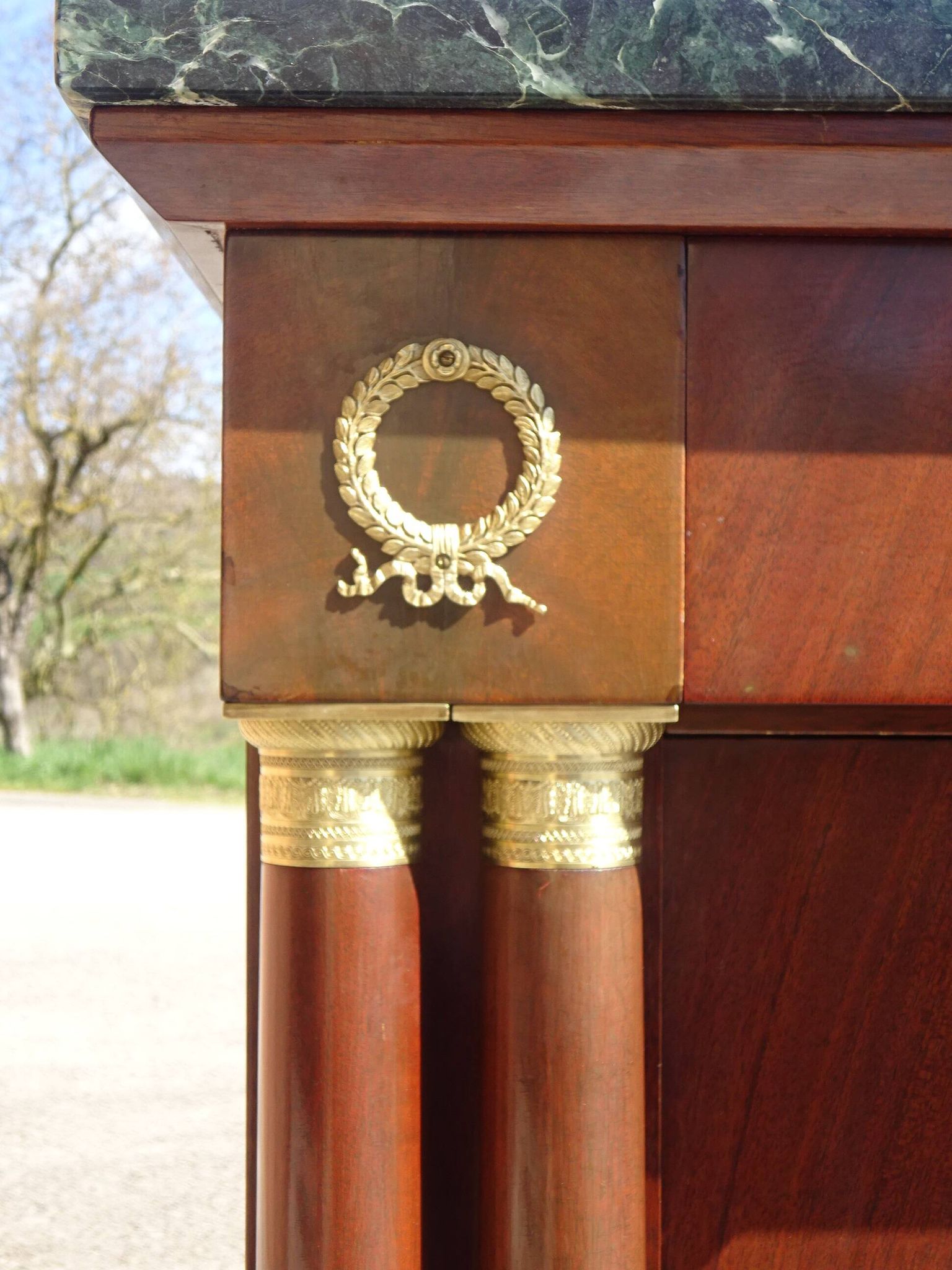 Flamed mahogany enfilade with sea green marble in Empire style.
