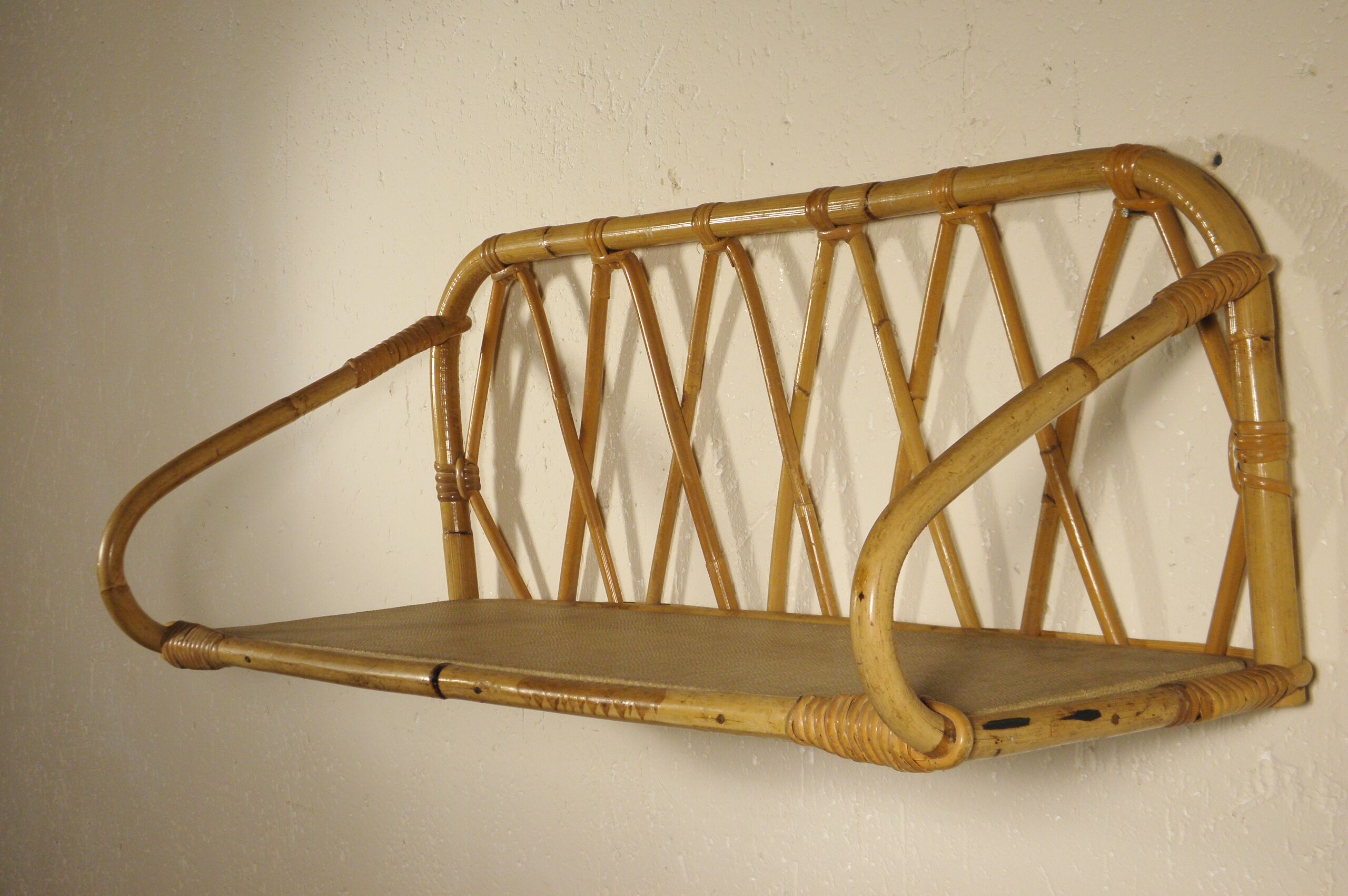 Rattan wall shelf