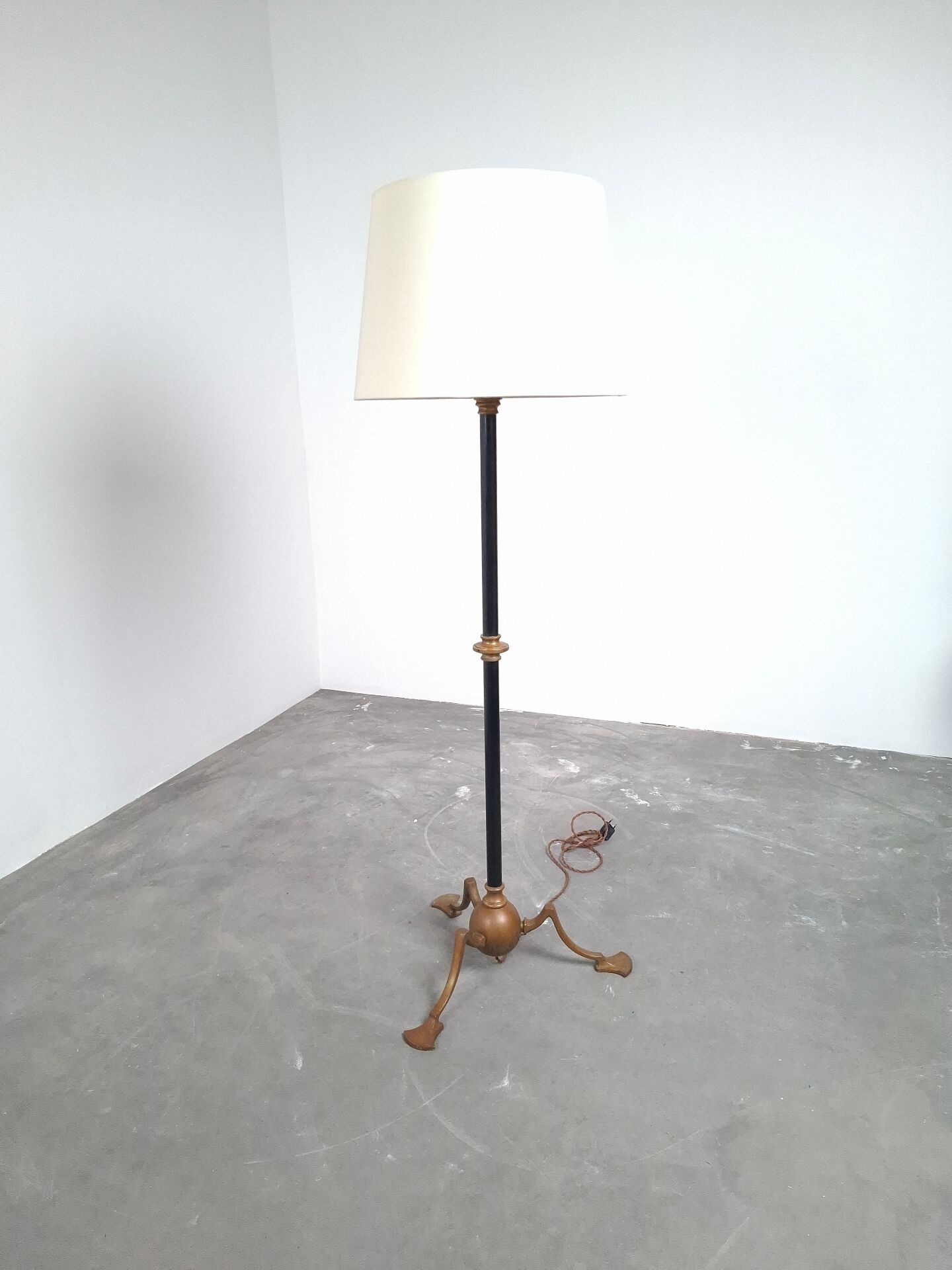 Art and Craft tripod floor lamp in bronze.
