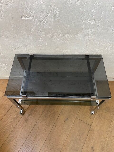 Vintage coffee table on chrome wheel and smoked glass