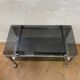Vintage coffee table on chrome wheel and smoked glass