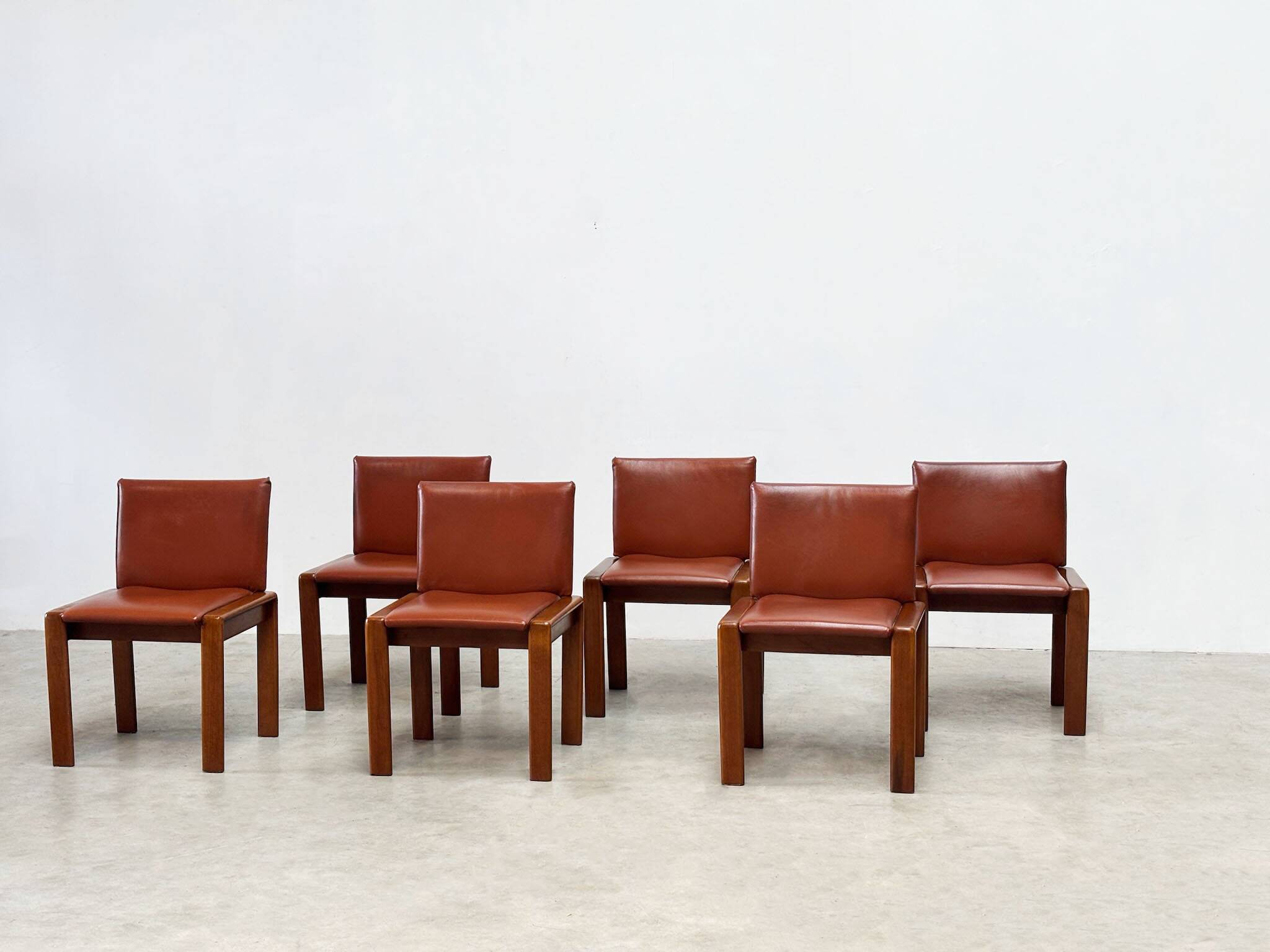 Set of six leather Italian dining chairs