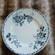 13 mismatched flat plates in ironstone