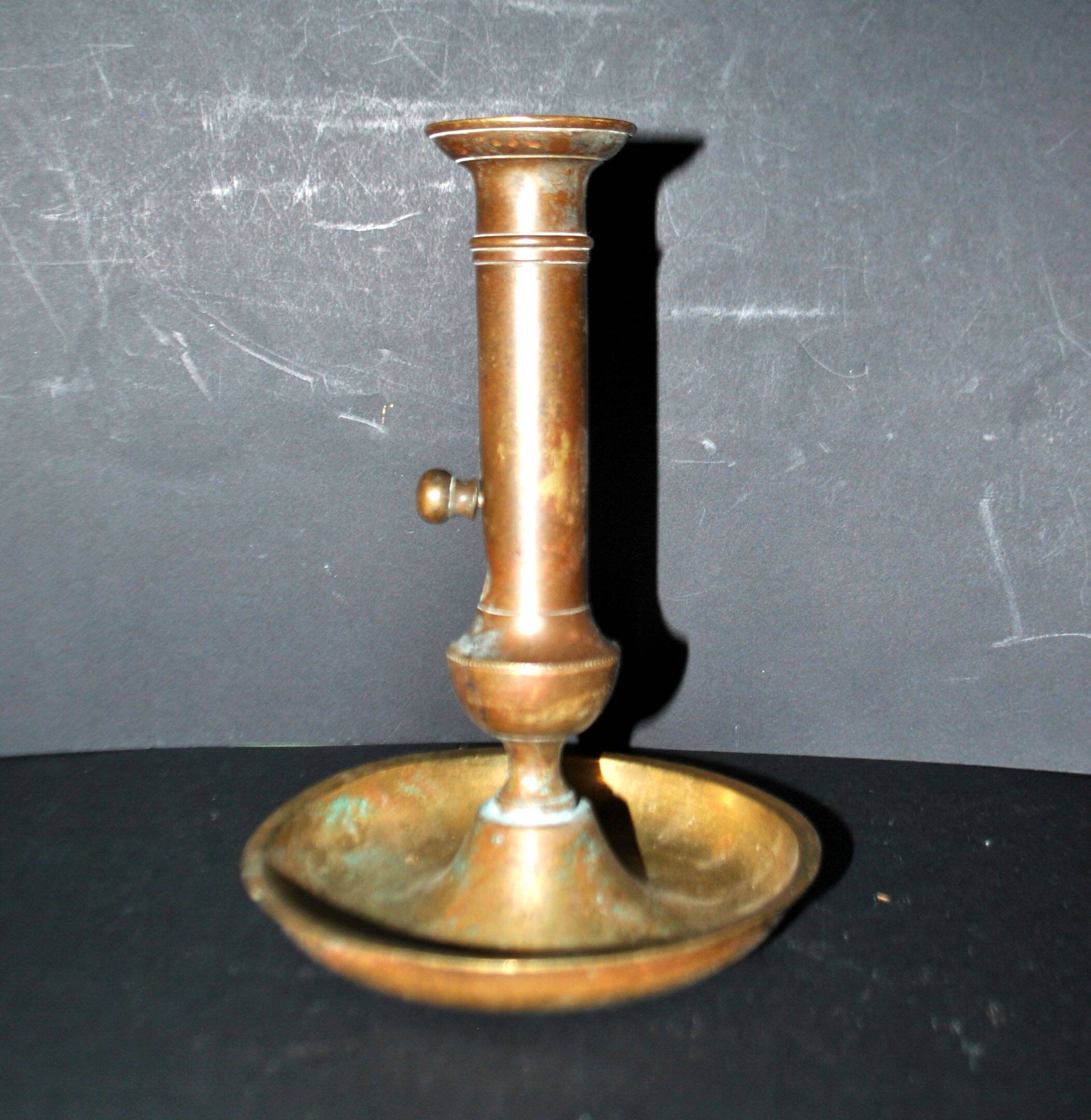 Antique push candle holder, 18th century gilded carved bronze candlestick.