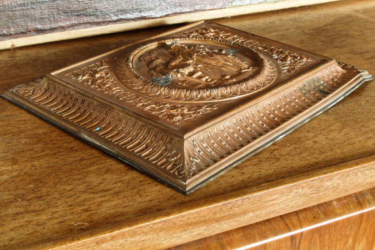 Repoussé copper plaque, early 19th century, in Neoclassical style.