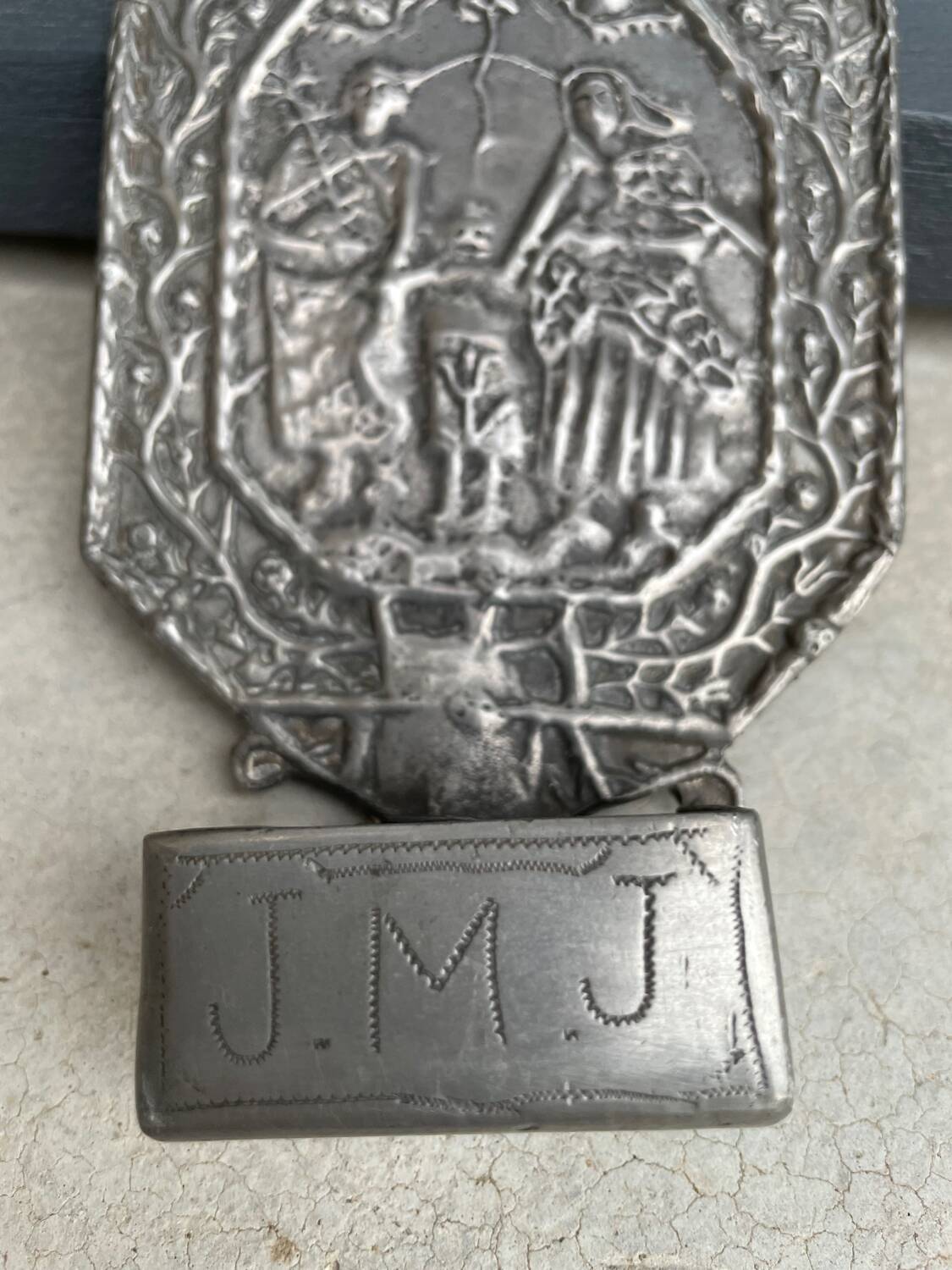 Small wall-mounted holy water font