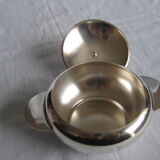 silver metal sugar and silver sugar spoon.