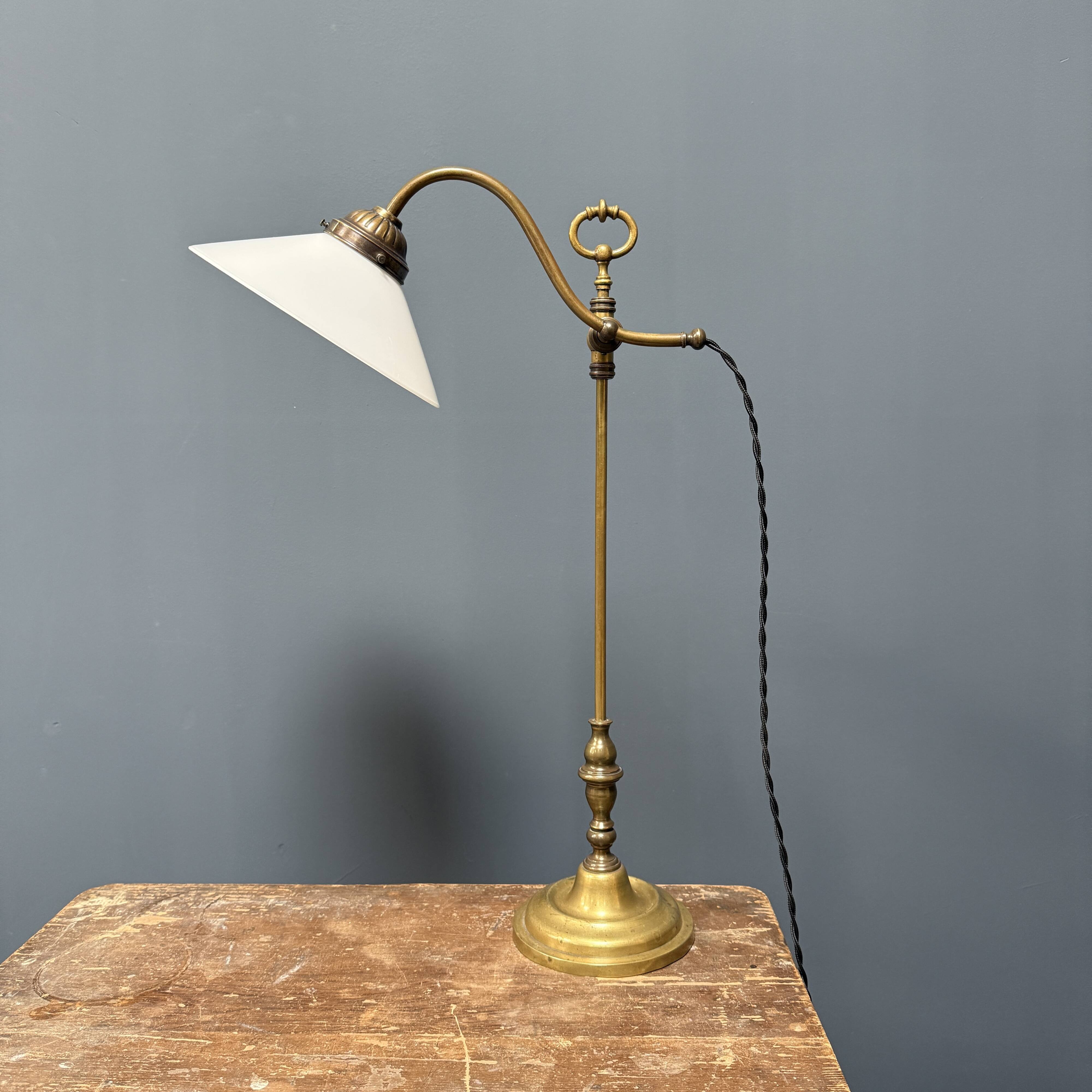 Adjustable brass table lamp with opaline glass shade