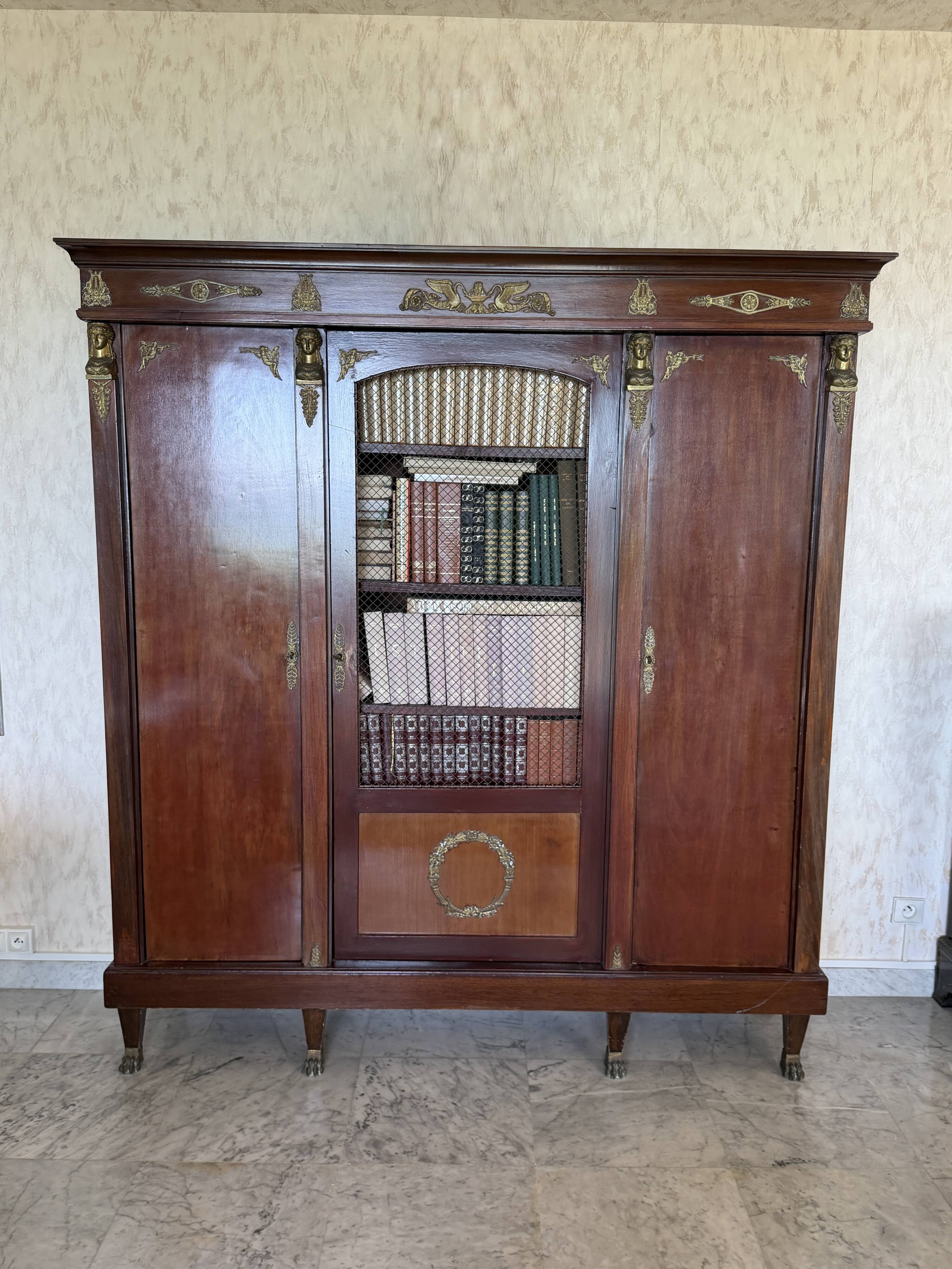 Large antique library from the Empire/Napoleon III period in mahogany and gilded bronze.