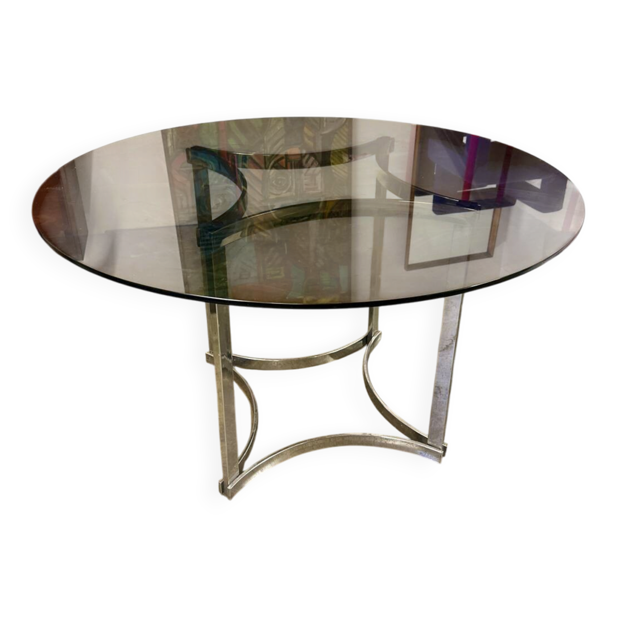 Dining table in chrome metal and smoked glass.