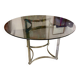 Dining table in chrome metal and smoked glass.