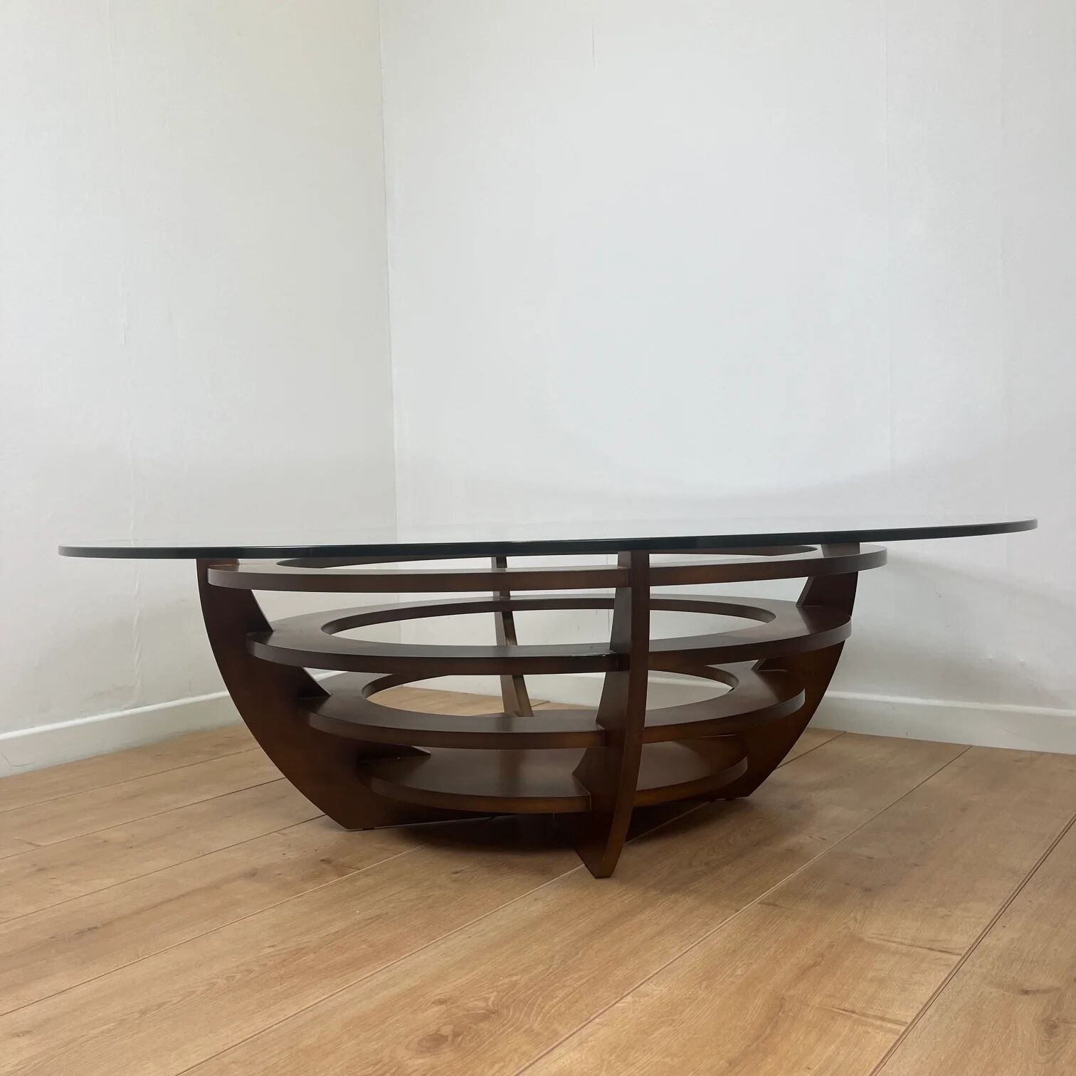 Sculptural coffee table with concentric rings, glass and wood, circa 1985.