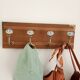 Wall-mounted coat rack with 4 ceramic hooks in blue and white, vintage style.
