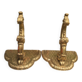 Important, pair of wooden consoles with gilded stucco in Louis XV style, 19th century.