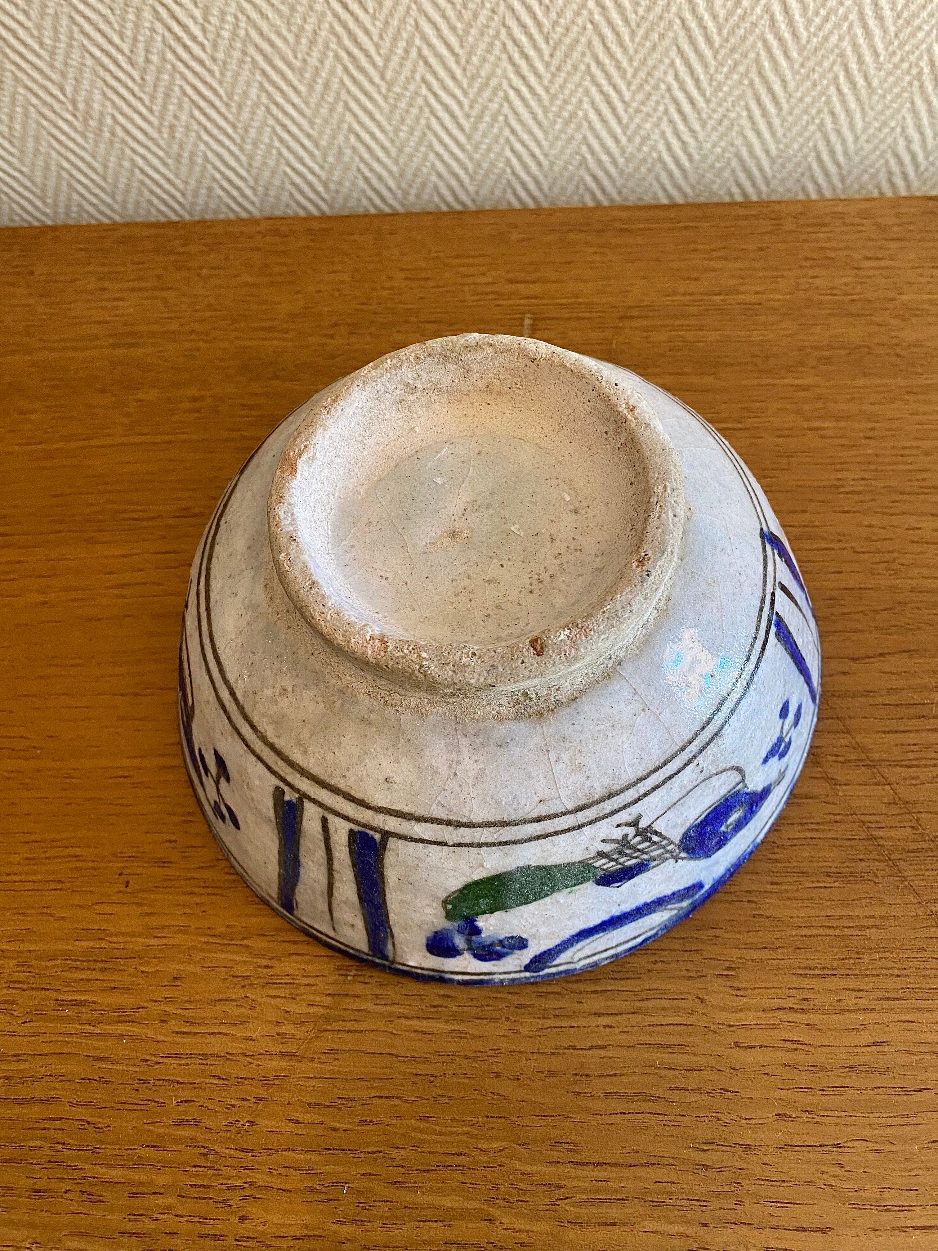 Ancient Persian ceramic bowl in Qajar style.