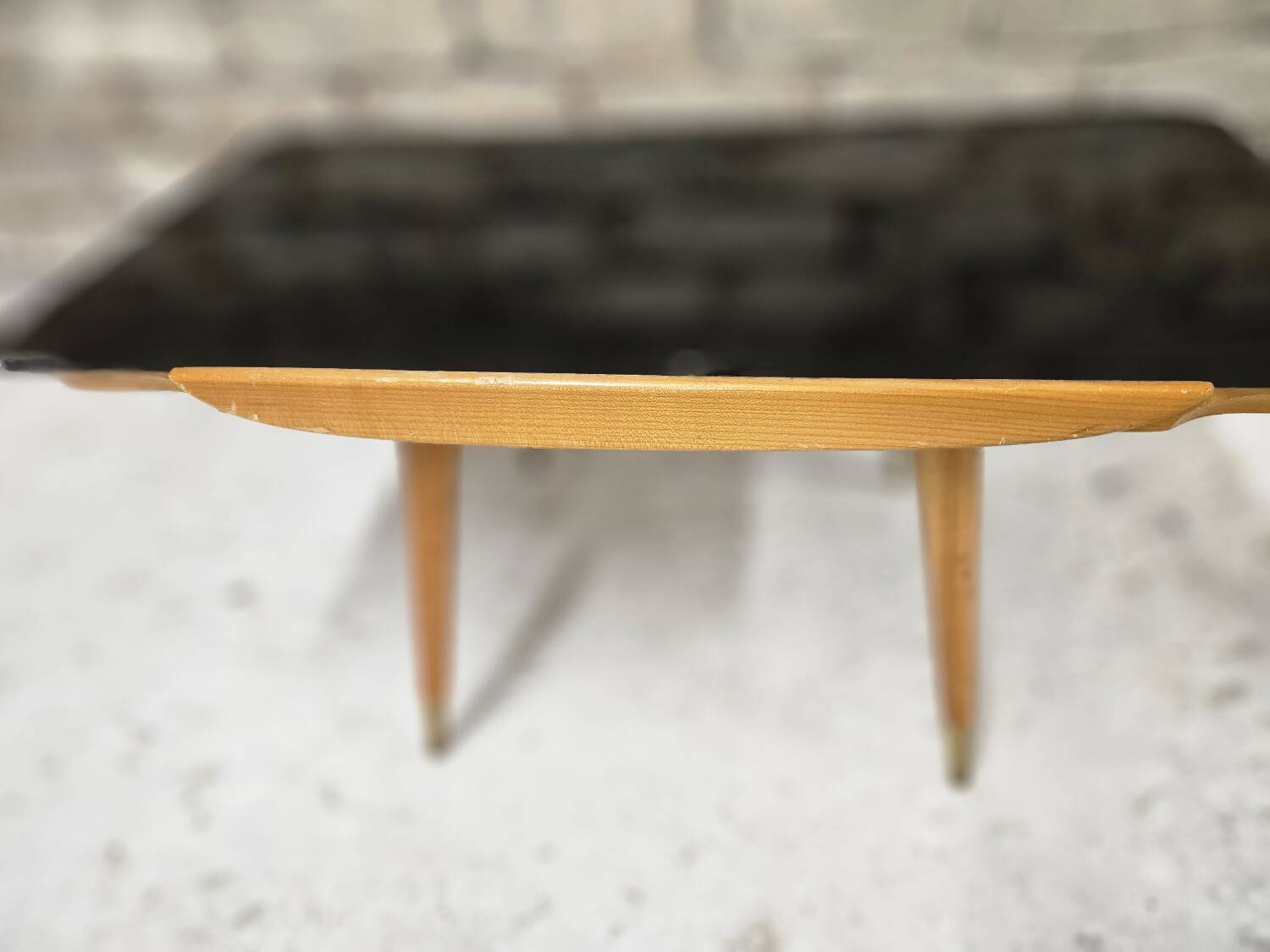 Small opaque black glass coffee table 1960