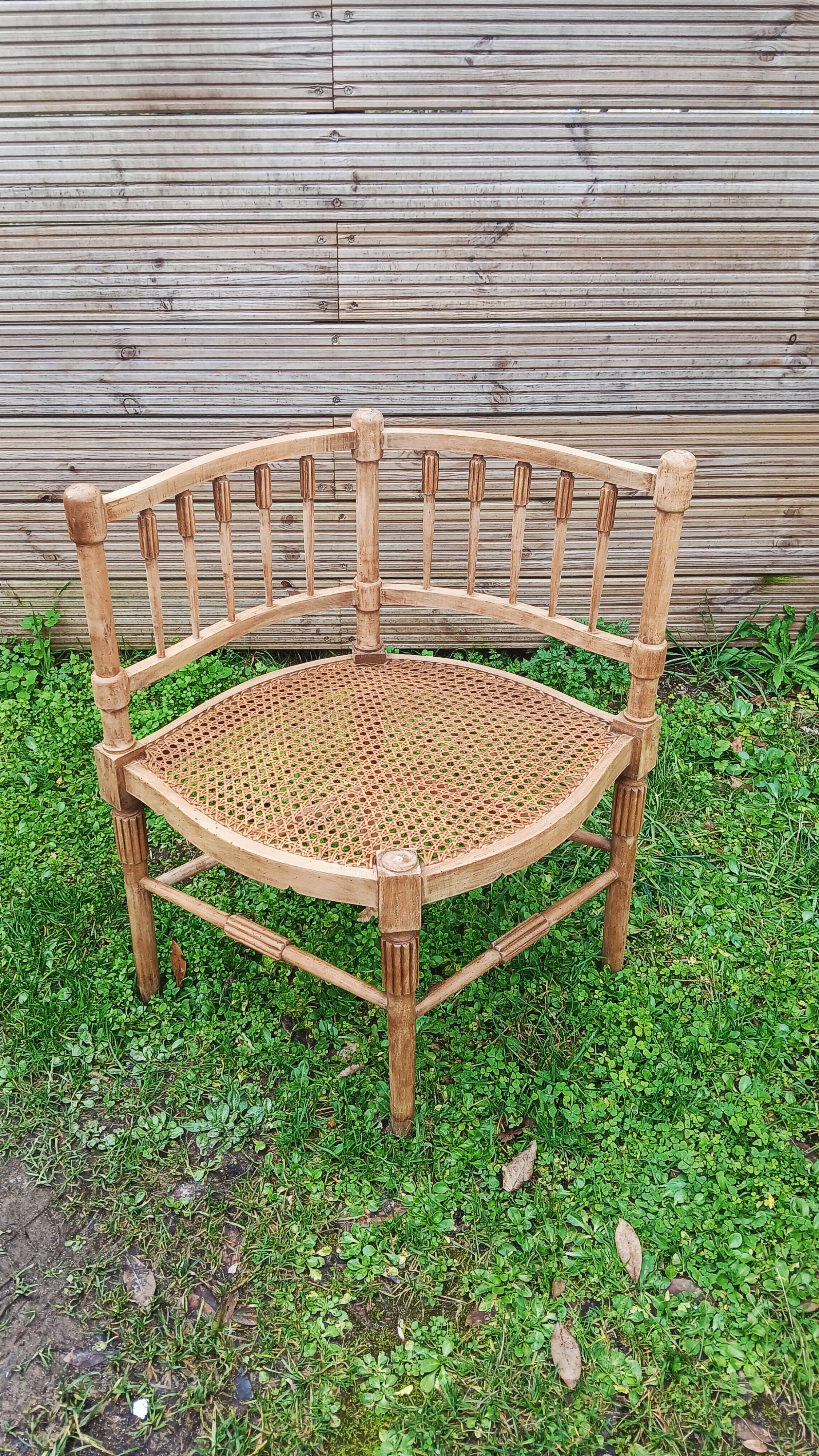 Corner chair in beech, caned seat from the early 20th century.