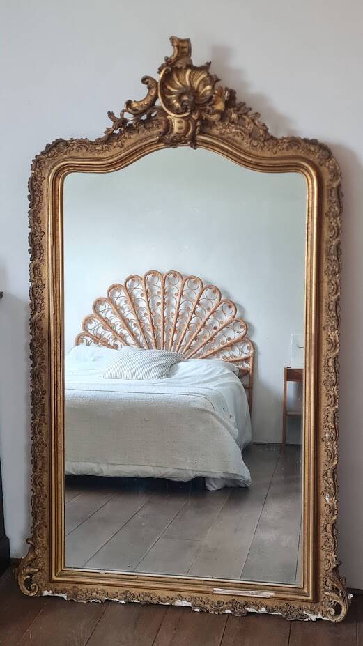 Antique Louis Philippe mirror with a pediment.
