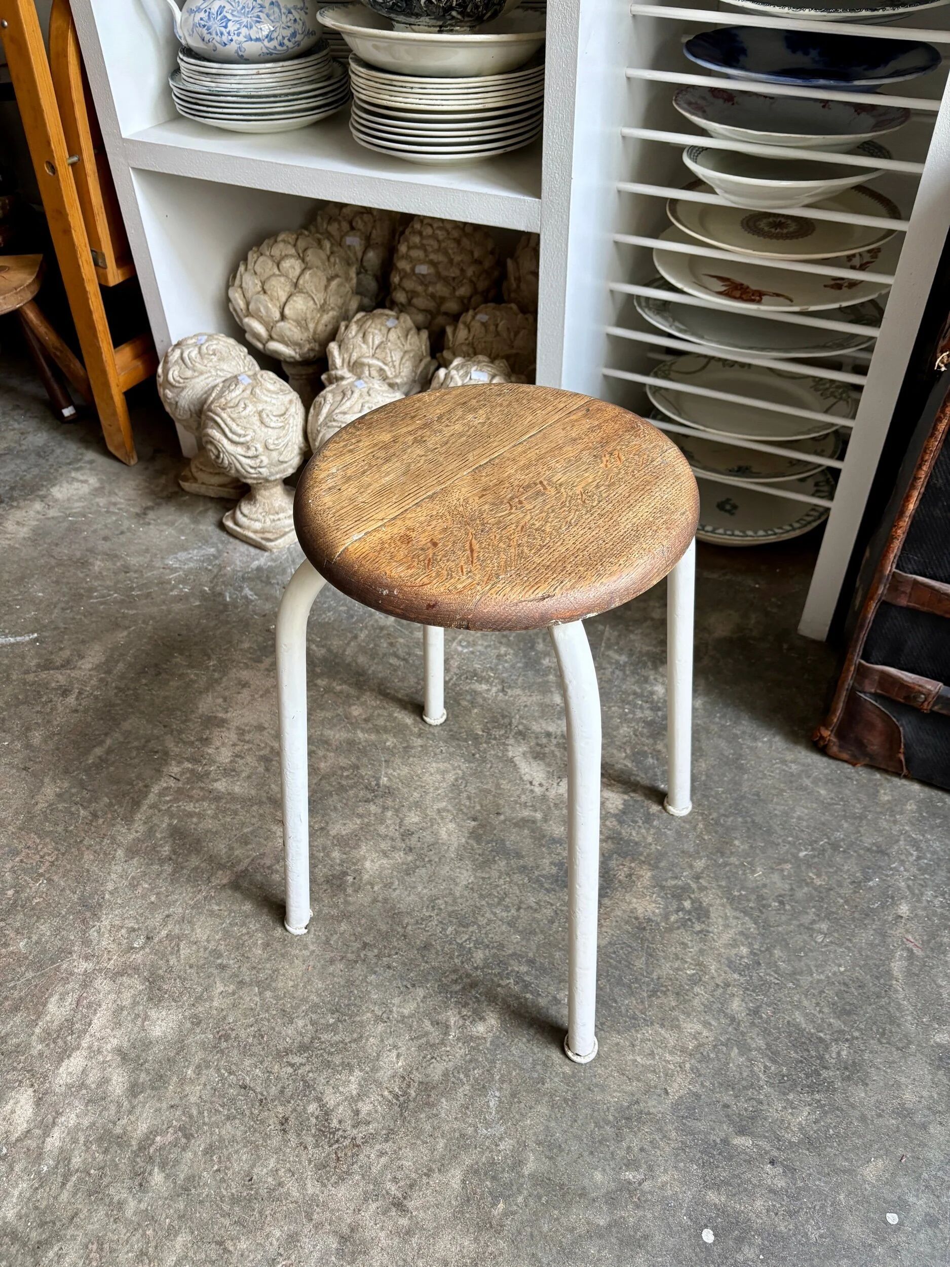 White tubular metal and wood stool