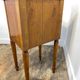 Louis XVI style bedside table, with a marble top and marquetry.