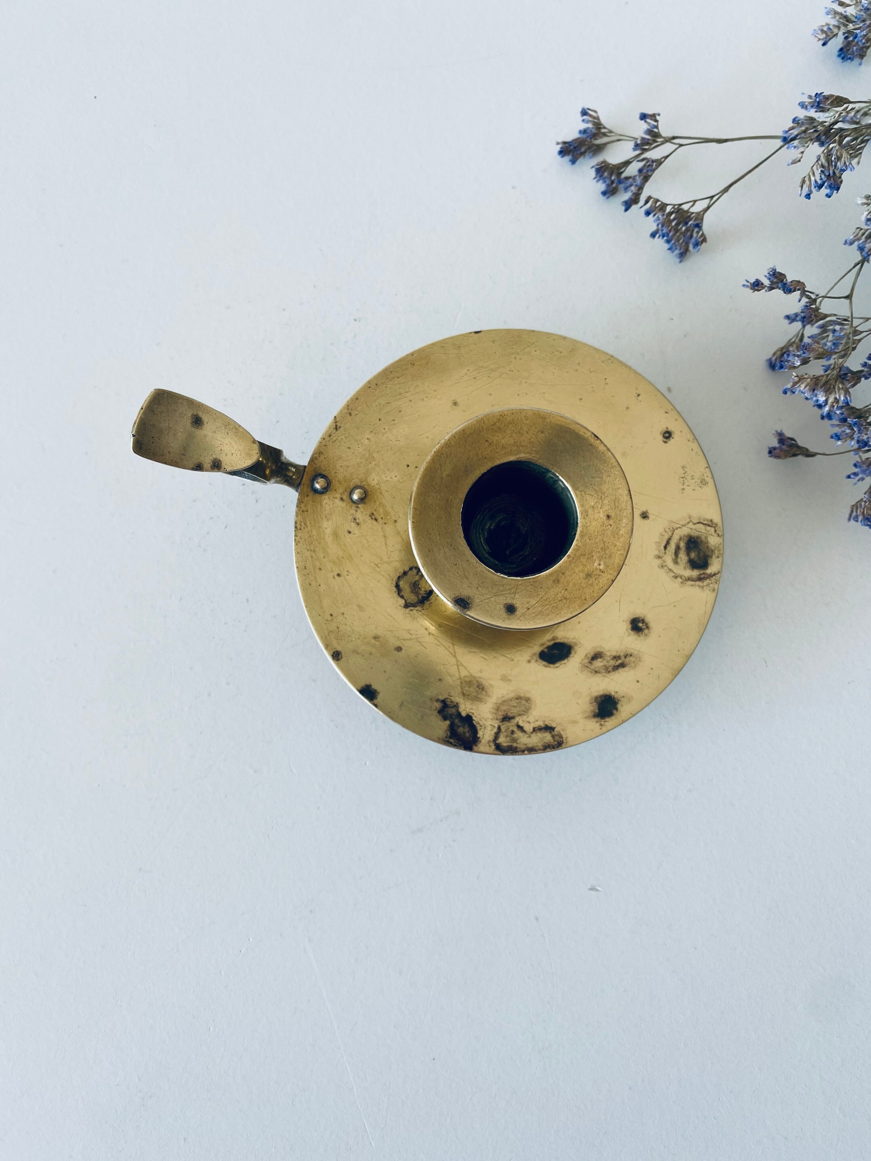 Old candle holder with handle