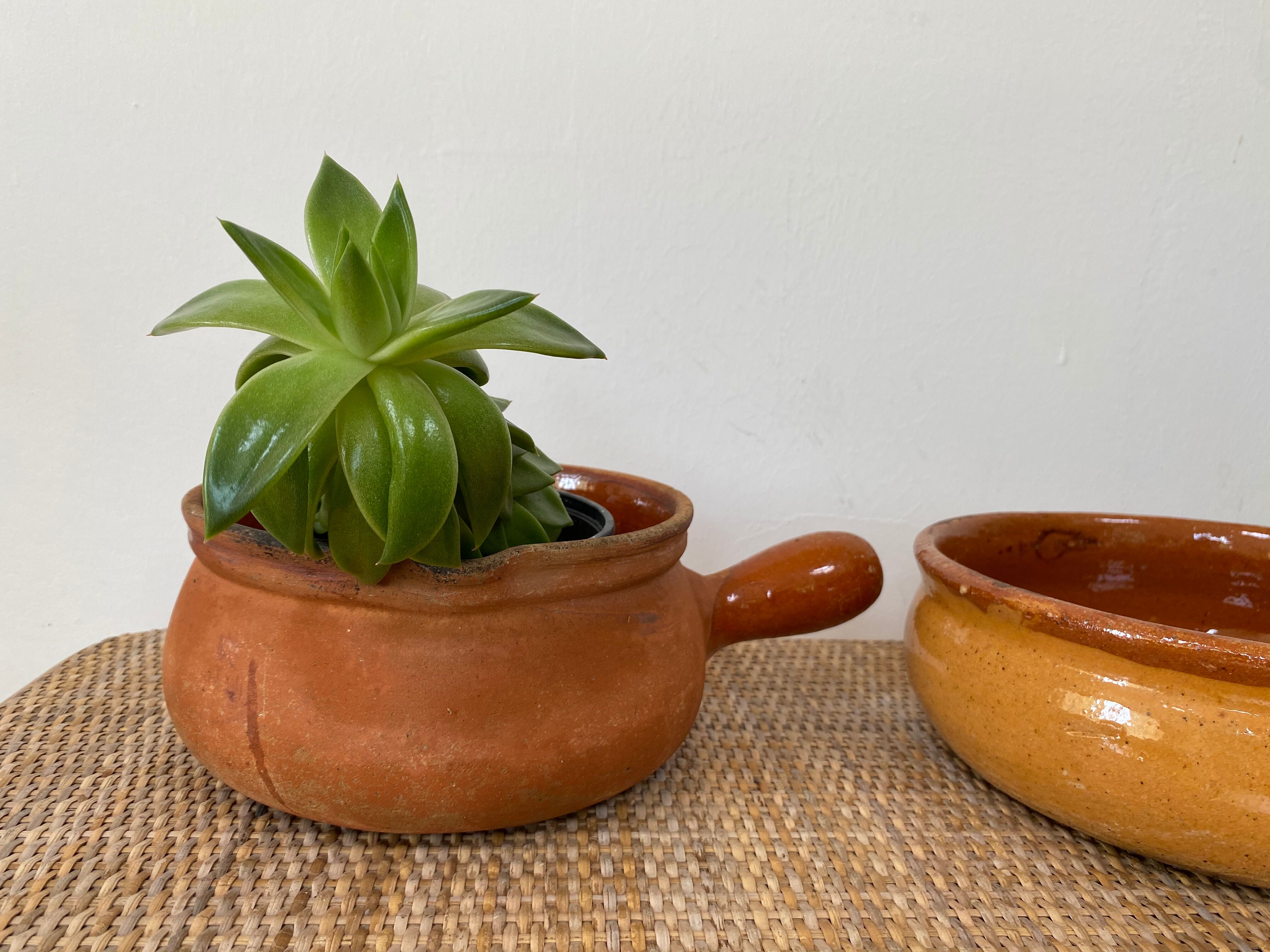 Pair of old pocket pots in glazed stoneware