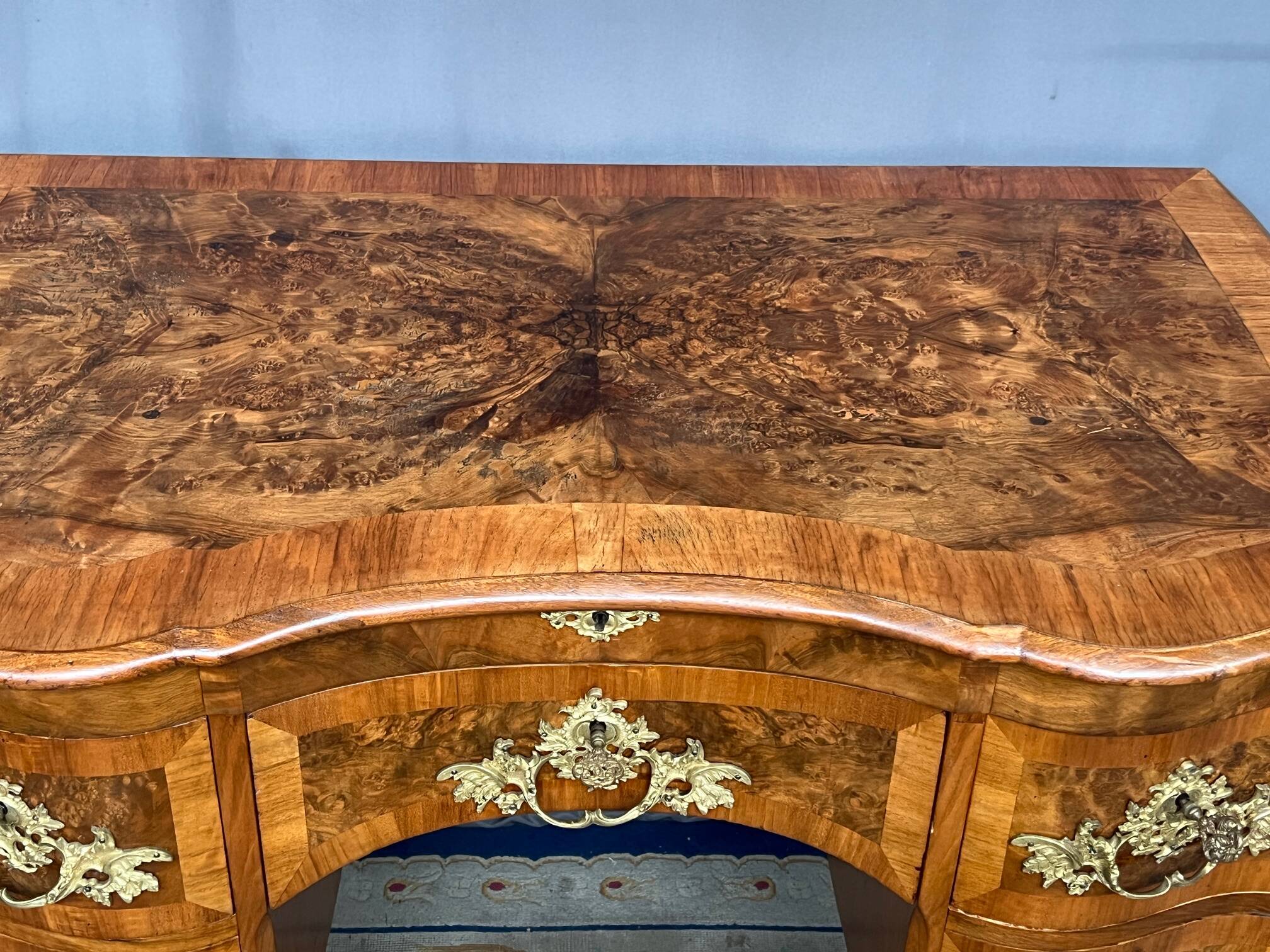 Antique baroque-style desk from Dresden with five drawers.