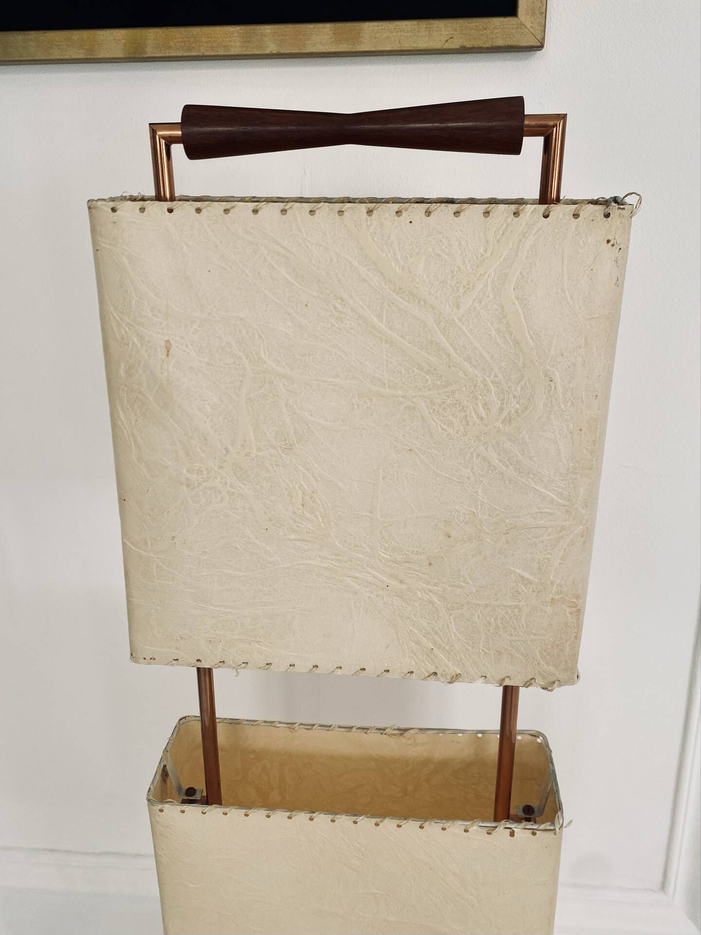 Wood and copper metal floor lamp with parchment.