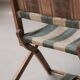 Foldable chair in solid wood and striped fabric, circa 1900.