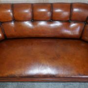 Victorian Chesterfield leather canapé with oak lion claw feet.