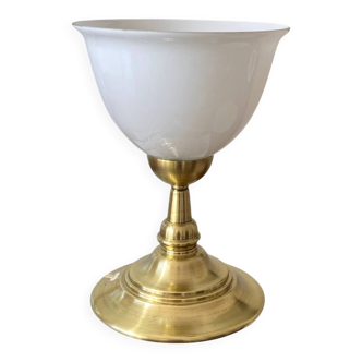 Antique white opaline glass globe table lamp with a brass base.