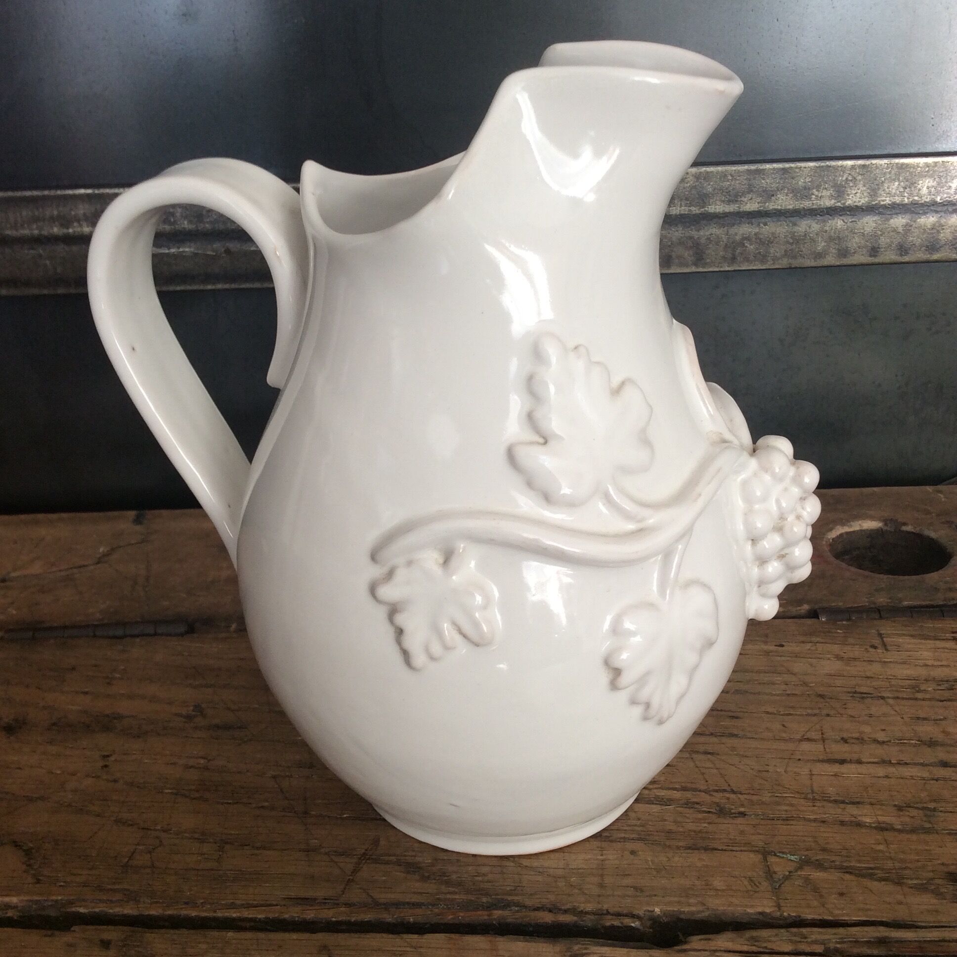 White enamelled ceramic pitcher signed emile tessier malicorne grape bunch