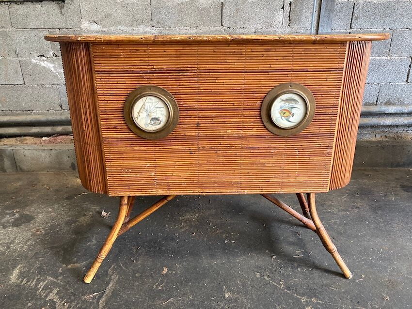 Rattan and wood bar with its decorative brass portholes