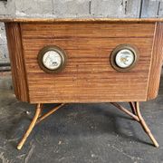 Rattan and wood bar with its decorative brass portholes