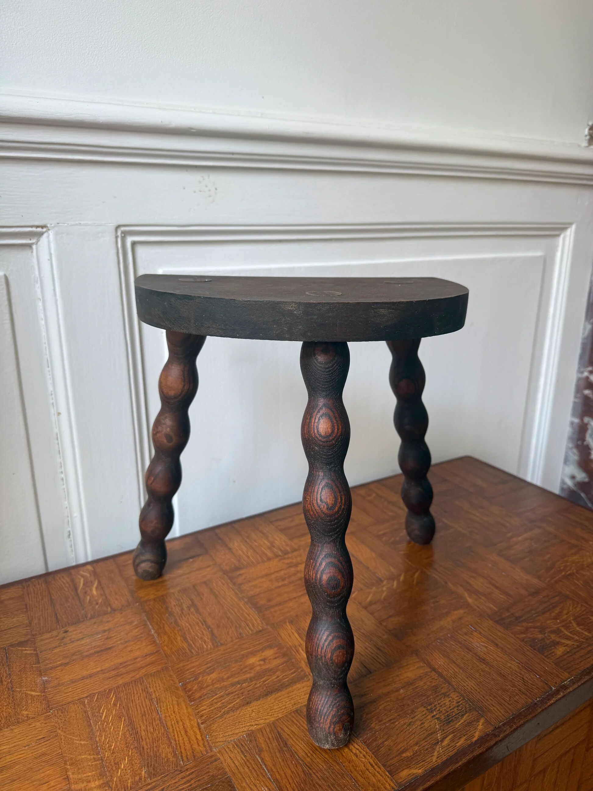 Three-legged turned wooden stool