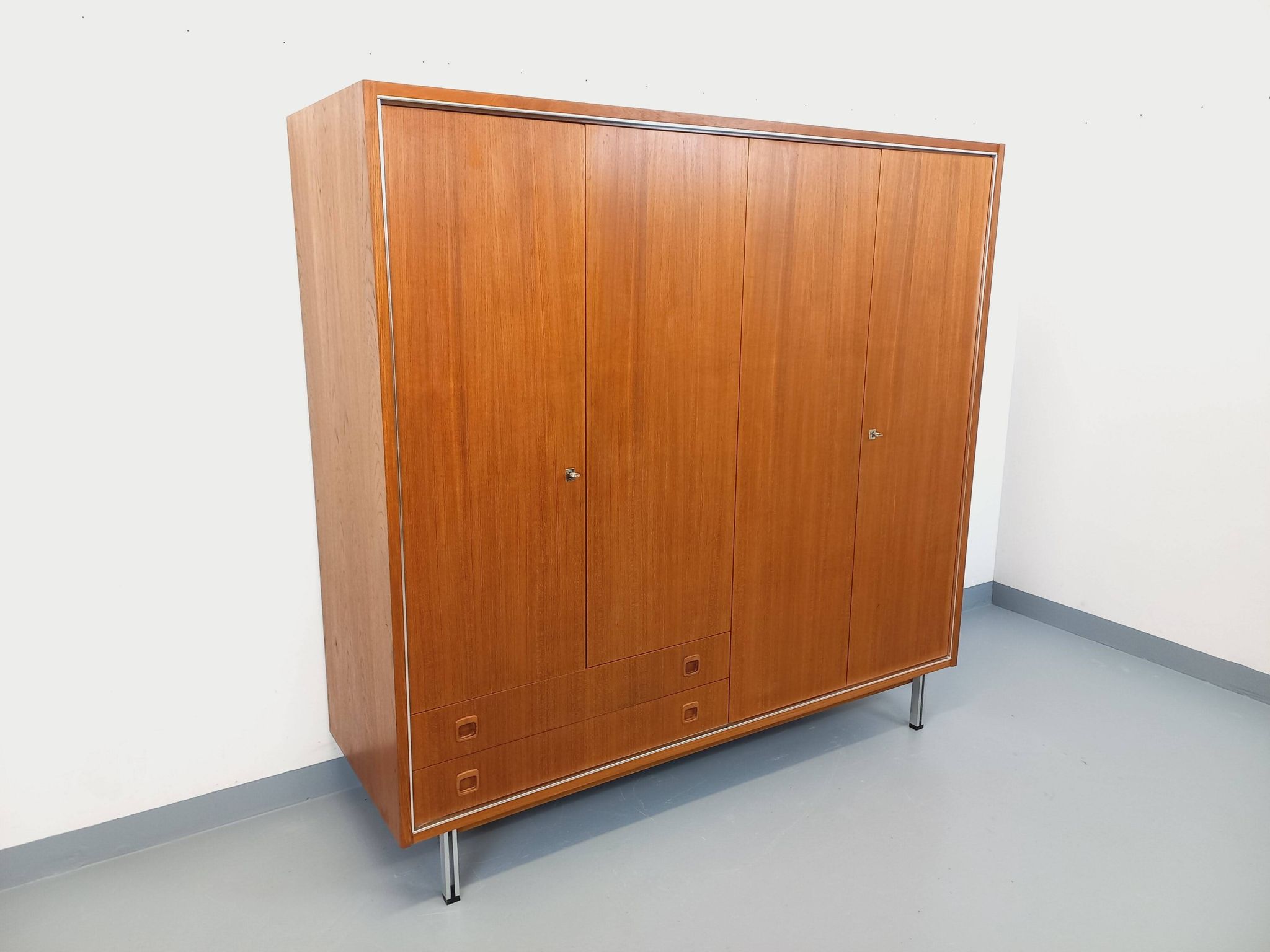 Vintage Scandinavian modernist wardrobe in teak and metal from the 1960s.