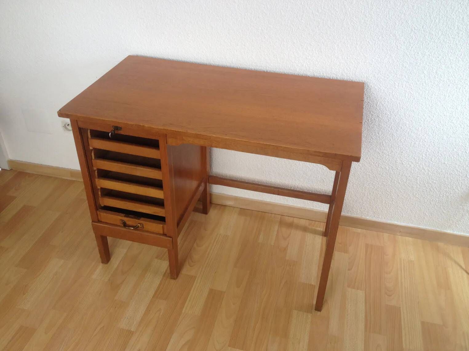 Vintage 1950s oak desk with sliding curtain.
