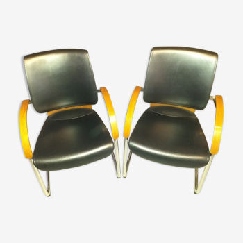 Chairs in leather, walnut and chrome