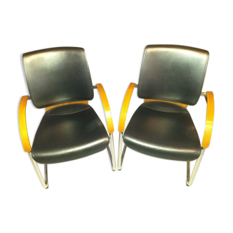 Chairs in leather, walnut and chrome