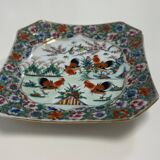 Porcelain plate with several roosters