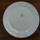 Six flat plates made of "Salins" earthenware