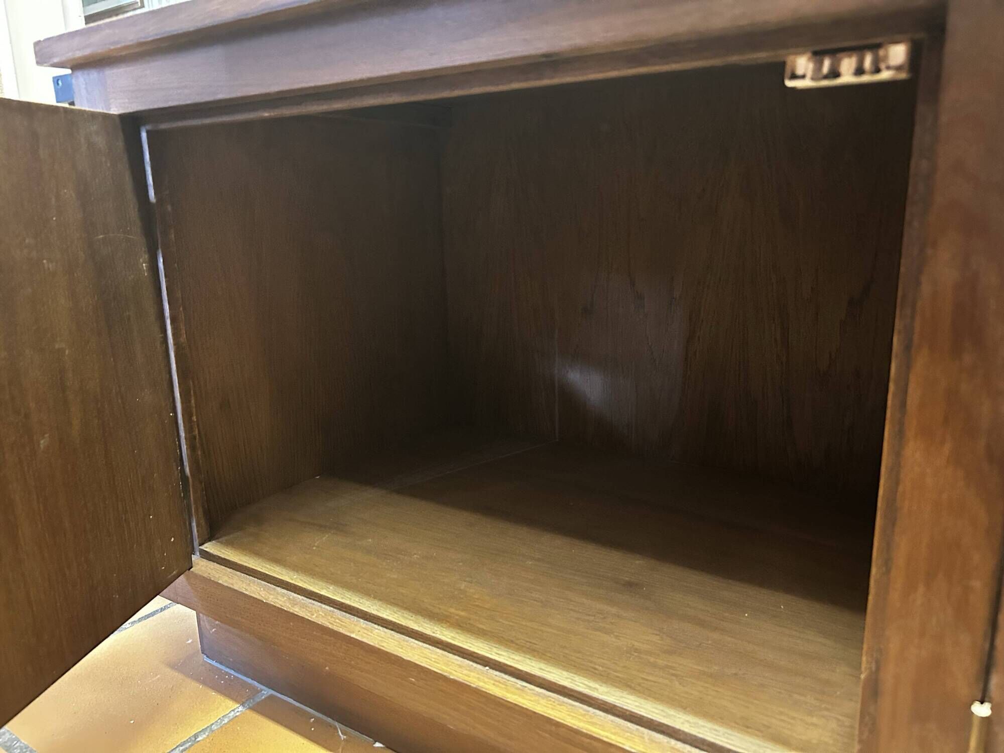 Vintage wooden and glass display cabinet, 15 shelves, gold background.