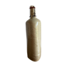 Old triangular bottle in glazed sandstone