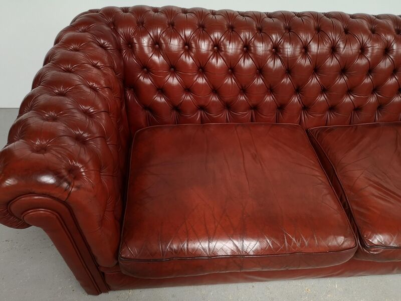 Old red leather Chesterfield sofa