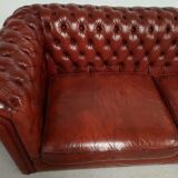 Old red leather Chesterfield sofa
