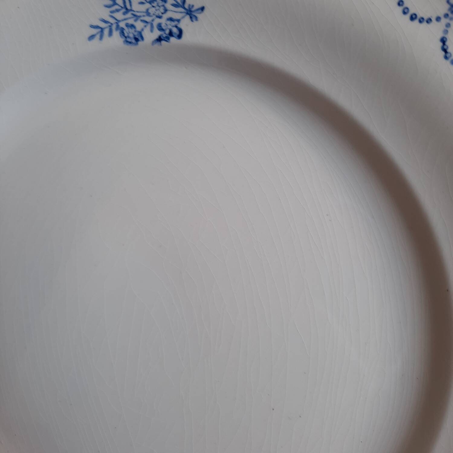 Old mismatched dinner plates accompanied by a dish