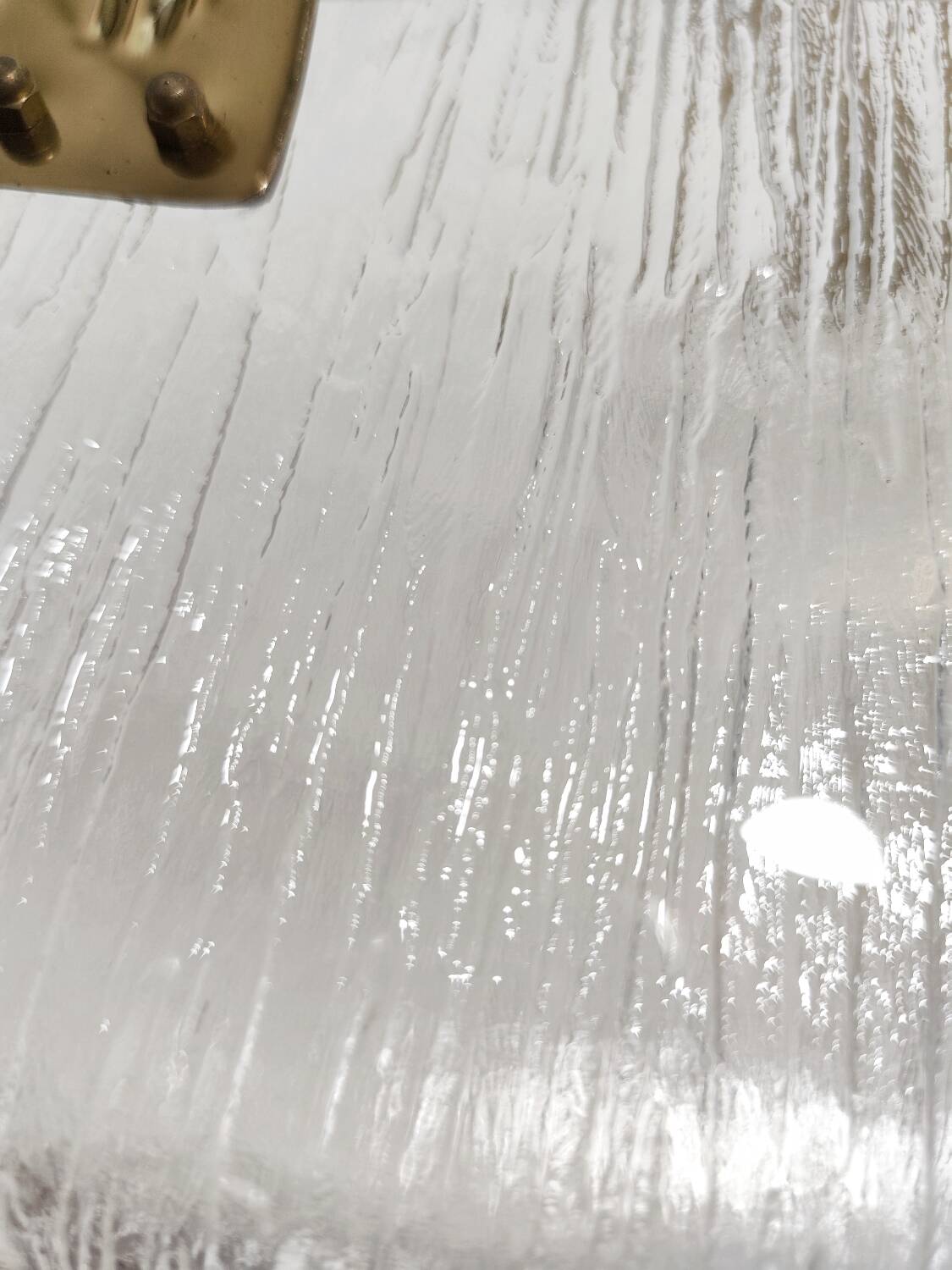 Revistero de metacrilato y latón. España, 1980s.