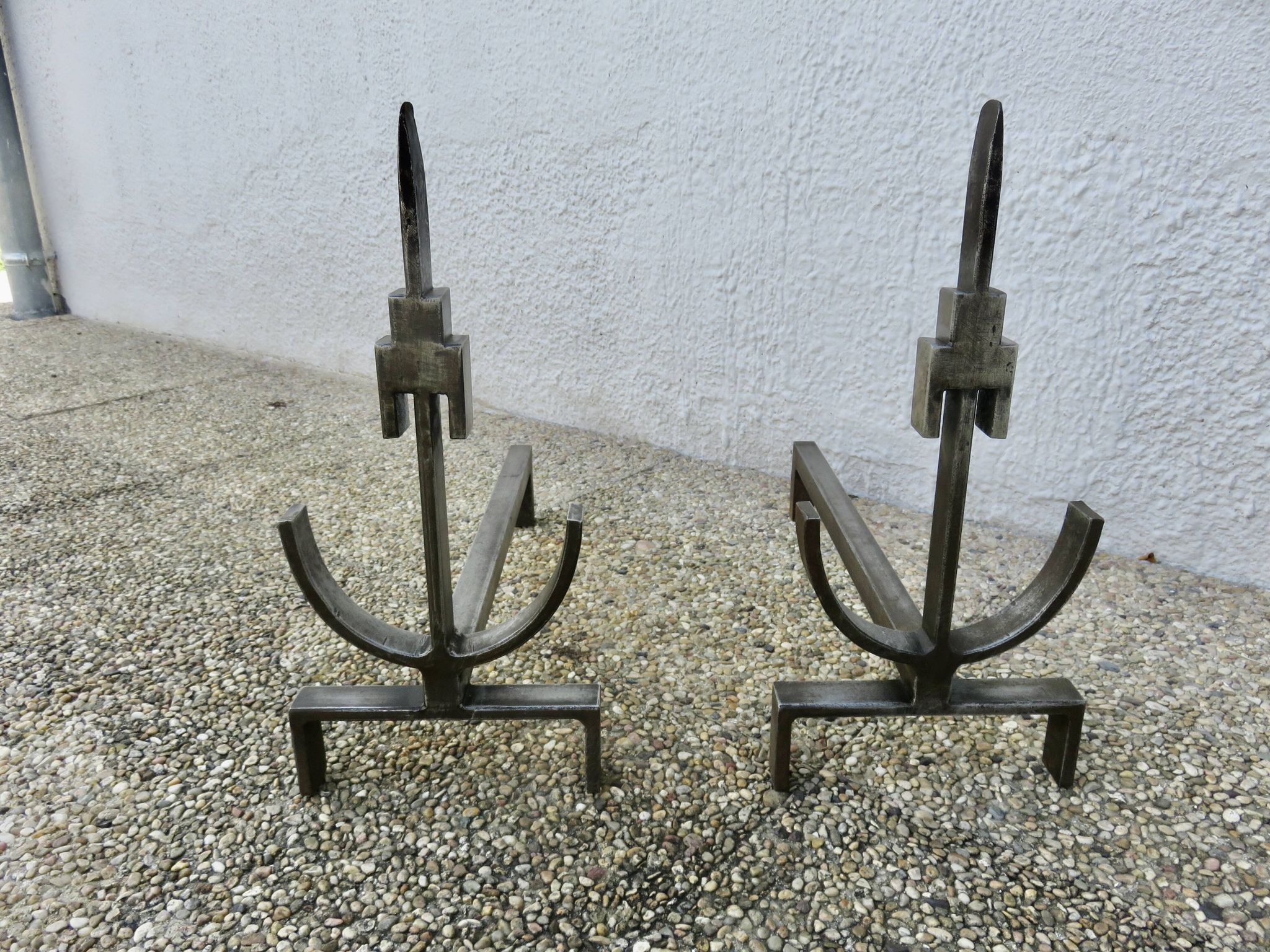 Pair of modernist andirons in forged and hammered steel, French work